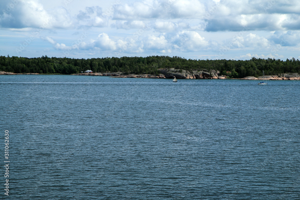 The Picture from a ferry between Sweden and Finland. The small Swedish islands are visible from the boat. The Picture from a ferry between Sweden and Finland. The small Swedish islands are visible from the boat.