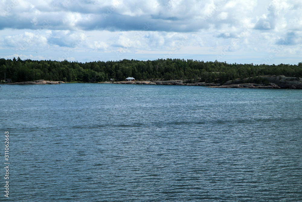 The Picture from a ferry between Sweden and Finland. The small Swedish islands are visible from the boat. The Picture from a ferry between Sweden and Finland. The small Swedish islands are visible from the boat.