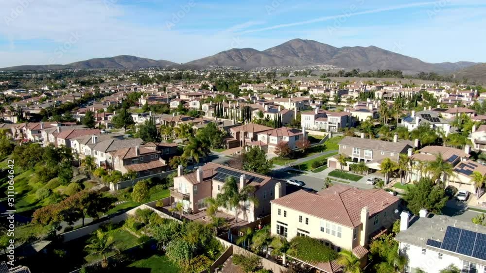 Aerial view of upper middle class neighborhood with identical residential subdivision houses during sunny day in Chula Vista, California, USA. Aerial view of upper middle class neighborhood with identical residential subdivision houses during sunny day in Chula Vista, California, USA.