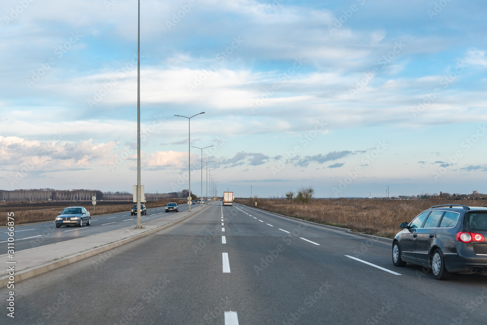 vehicles are moving along the road, view from the car vehicles are moving along the road, view from the car