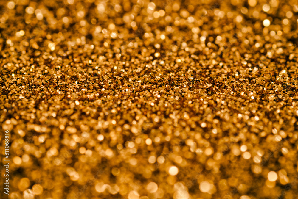 Golden glittering pattern with nice bokeh effect. Golden glittering pattern with nice bokeh effect.