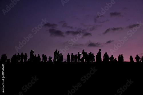 Edited background of travellers who are waiting for sunrise behind the foggy in the earliest morning.