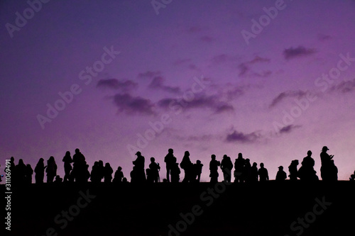 Edited background of travellers who are waiting for sunrise behind the foggy in the earliest morning.