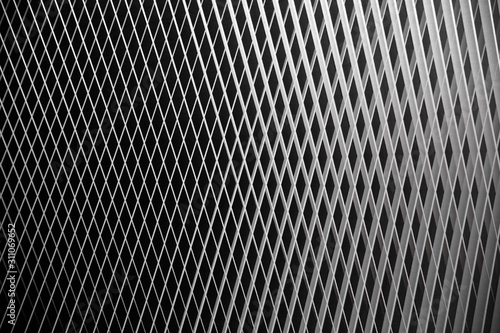 Digitally rendered image of metal grid structure. Abstract black and white checkered background for industry, technology or modern architecture issues. Geometric composition with cellular pattern. 