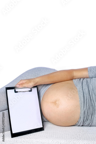 Happy pregnant girl lies on white background