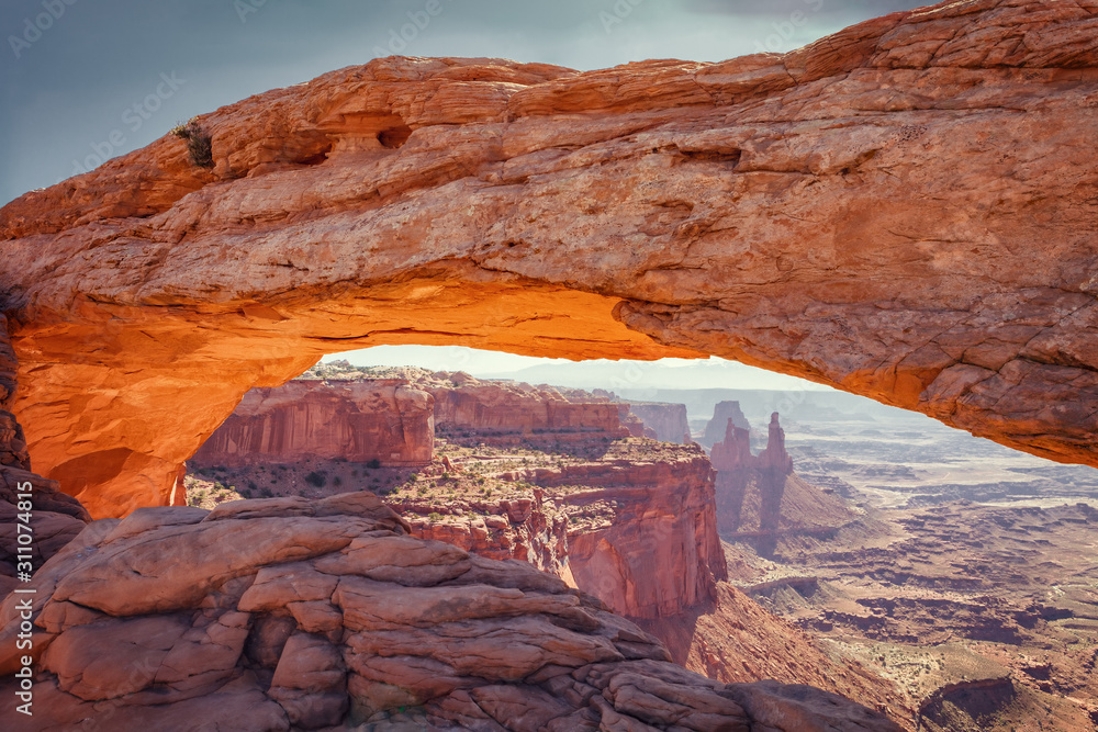 Mesa Arch is a sandstone arch on the eastern edge of the island on the Sky table in Canyonlands National Park in northern San Juan County, Utah