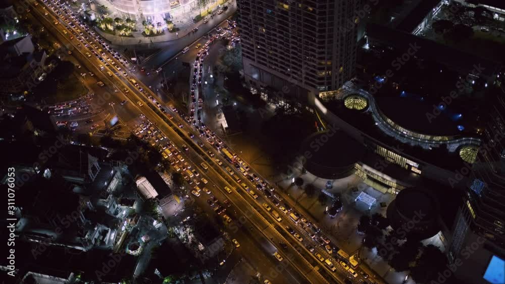 Traffic of vehicle on junction and Business building Bangkok city area background at night twilight evening time Traffic of vehicle on junction and Business building Bangkok city area background at night twilight evening time