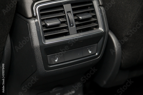 Control switch heated two rear seats on the car dashboard with plastic buttons to control the temperature of the passenger compartment and comfort while driving. Auto service industry. © Aleksandr Kondratov