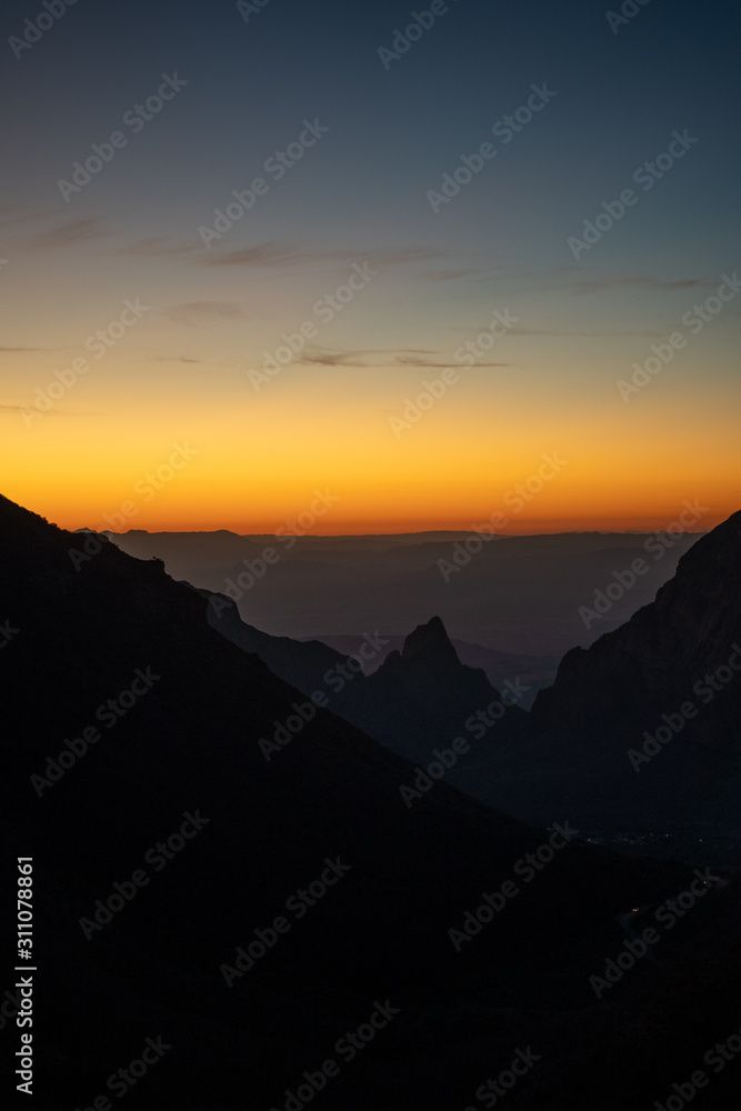 The sun sets over the mountains in West Texas.