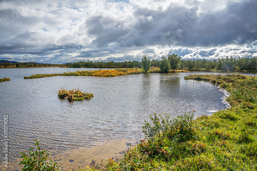 Þingvellir or Thingvellir national park in Iceland, is a site of historical, cultural, and geological significance, the fissure devides the tectonic plates of America and Eurasia photo