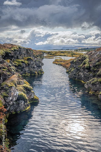 Þingvellir or Thingvellir national park in Iceland, is a site of historical, cultural, and geological significance, the fissure devides the tectonic plates of America and Eurasia photo