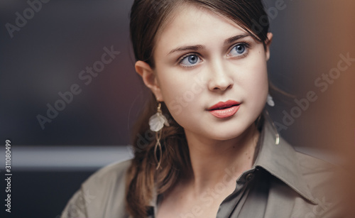 face of an office lady with hand-picked hair  businesswoman at work  success concept