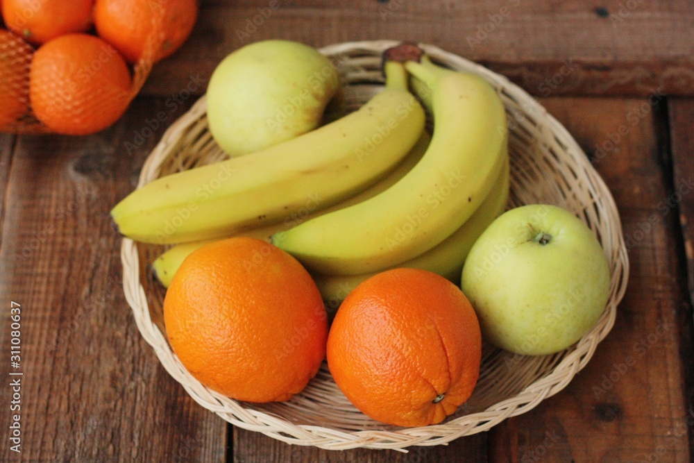 Oranges apples and bananas on the table Oranges apples and bananas on the table