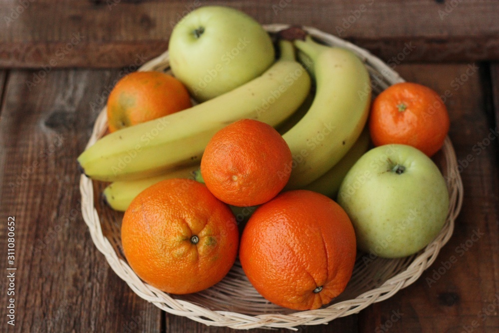 Oranges apples and bananas on the table Oranges apples and bananas on the table
