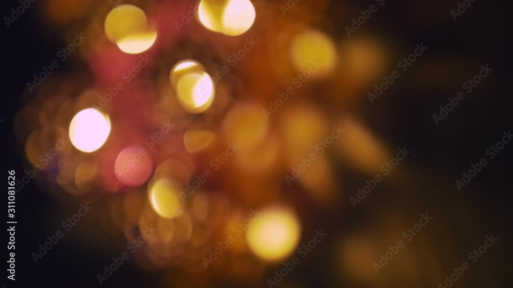 Magic lanterns spin and give beautiful glare to the walls. New Year glowing balls with led diodes are held in hands. Warm lamp light gives cosiness and christmas mood. Magic lanterns spin and give beautiful glare to the walls. New Year glowing balls with led diodes are held in hands. Warm lamp light gives cosiness and christmas mood.