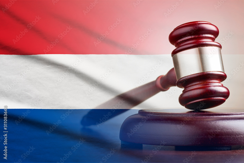 Legal gavel over a flag of the Netherlands