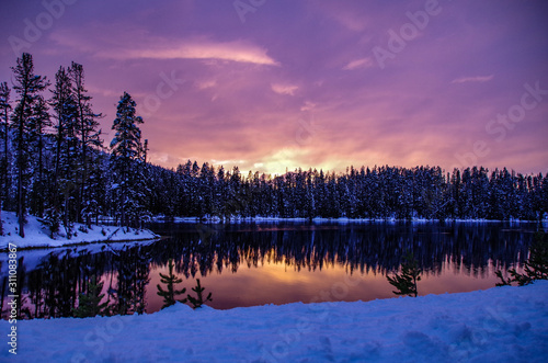 Winter Sunset on Snowy Forest Lake