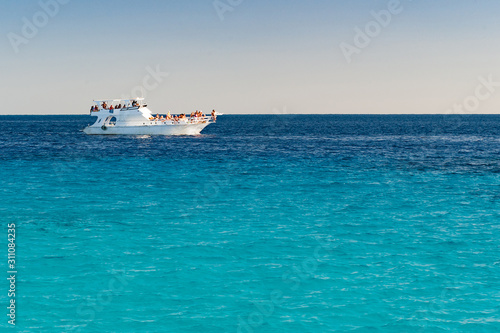 White boat in azure sea. Vacation background © ilyaska