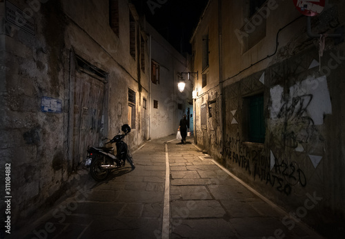 Walks in the old city. Night island of Crete.