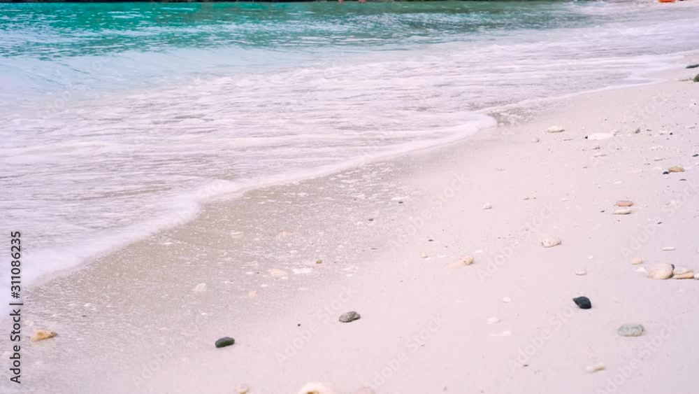 Clear water in the sunshine of a white beach on Boracay Island, Philippines. Clear water in the sunshine of a white beach on Boracay Island, Philippines.