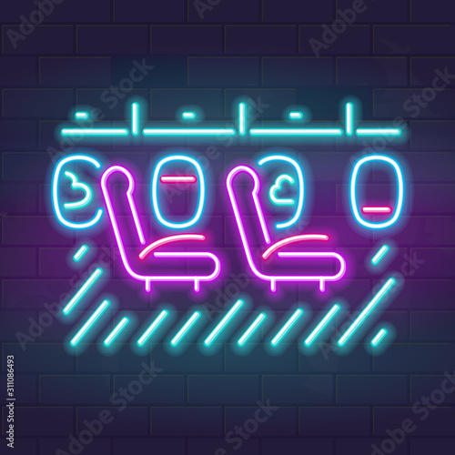 Neon airplane passenger seats near windows. Line art fluorescent travel interior. Glowing vector illustration on brick wall background.