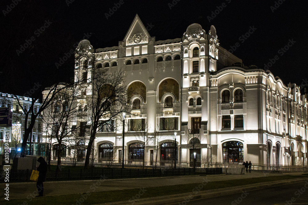 Polytechnic Museum building illuminated at night against the black sky in Moscow russia