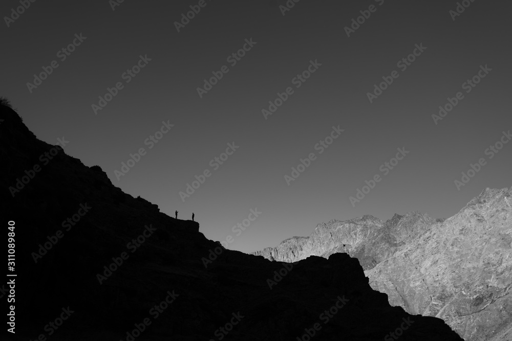 A panoramic view of Mount Kazbegi is a sleeping stratovolcano and one of the main mountains of the Caucasus, located on the border of the Kazbegi region of Georgia. In lush lava color. Design and crea A panoramic view of Mount Kazbegi is a sleeping stratovolcano and one of the main mountains of the Caucasus, located on the border of the Kazbegi region of Georgia. In lush lava color. Design and crea