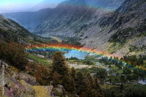 rainbow over mountain valley