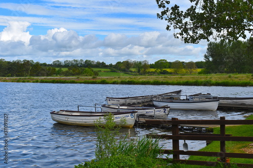 Fishing boats on water at Thorpe Malsor Reservoir ideal for fly fishing in Northamptonshire. Thorpe Malsor Trout Fishery is a club which offers annual membership. No day fishing tickets available.