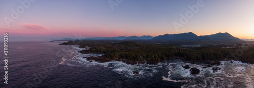 Ucluelet, Vancouver Island, British Columbia, Canada. Aerial Panoramic View of a Small Town near Tofino on a Rocky Pacific Ocean Coast during a cloudy and colorful morning sunrise.