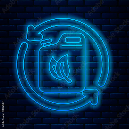 Glowing neon line Bio fuel canister icon isolated on brick wall background. Eco bio and barrel. Green environment and recycle. Vector Illustration