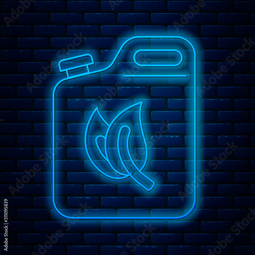 Glowing neon line Bio fuel canister icon isolated on brick wall background. Eco bio and barrel. Green environment and recycle. Vector Illustration