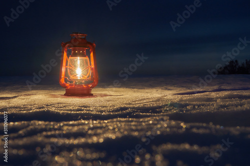 Lighted snow by an oil lamp