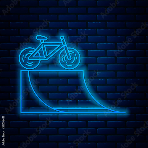 Glowing neon line Bicycle on street ramp icon isolated on brick wall background. Skate park. Extreme sport. Sport equipment. Vector Illustration