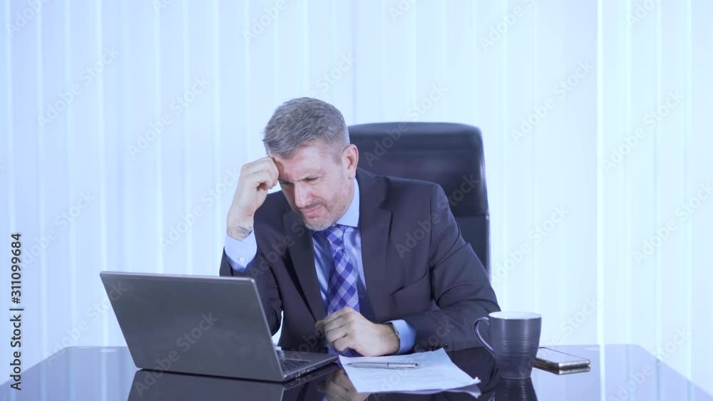 Confused hispanic businessman working in the office while thinking his jobs. Shot in 4k resolution Confused hispanic businessman working in the office while thinking his jobs. Shot in 4k resolution
