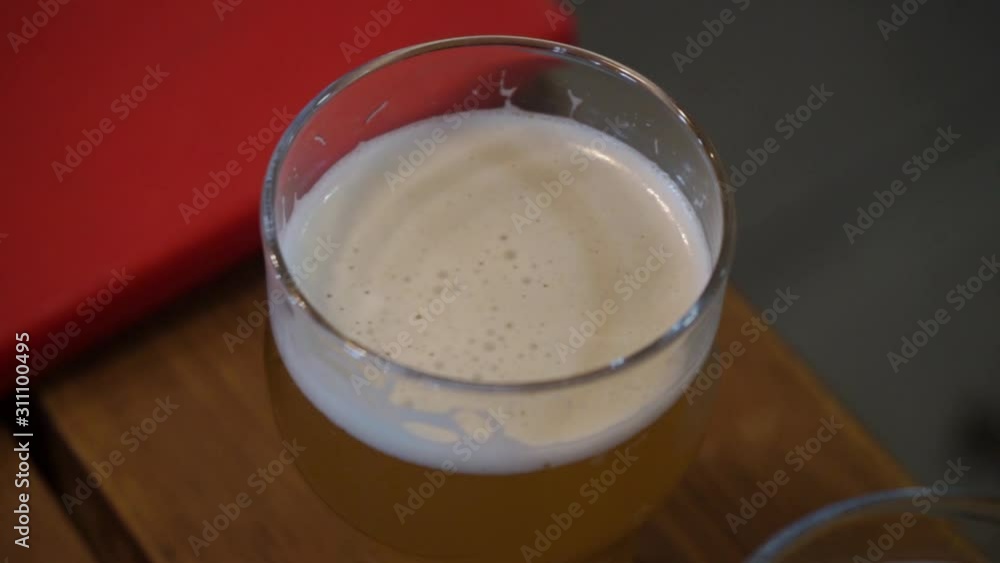 glasses with foaming aromatic beer glasses with foaming aromatic beer