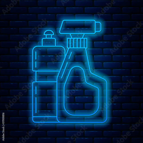 Glowing neon line Plastic bottles for liquid laundry detergent, bleach, dishwashing liquid or another cleaning agent icon isolated on brick wall background. Vector Illustration