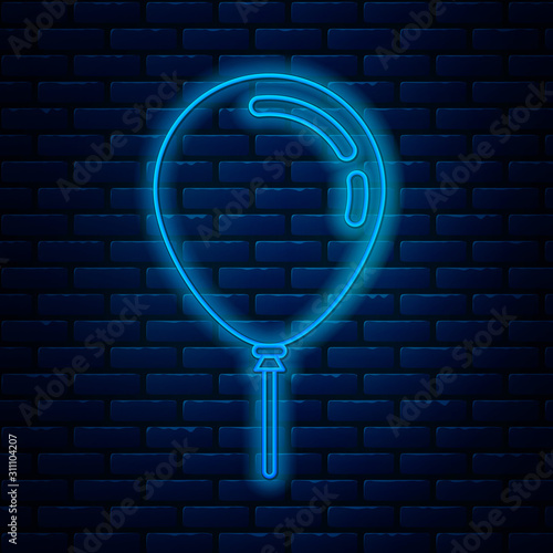 Glowing neon line Balloon with ribbon icon isolated on brick wall background. Vector Illustration