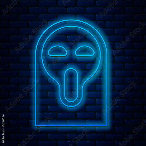 Glowing neon line Funny and scary ghost mask for Halloween icon isolated on brick wall background. Happy Halloween party. Vector Illustration