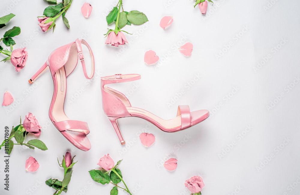 coral sandals on white background Flat lay, top view trendy fashion feminine background. Beauty blog concept. coral sandals on white background Flat lay, top view trendy fashion feminine background. Beauty blog concept.