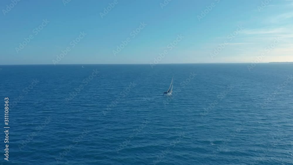 Aerial view. Sailing yacht on the sea at the sunset. Aerial view. Sailing yacht on the sea at the sunset.