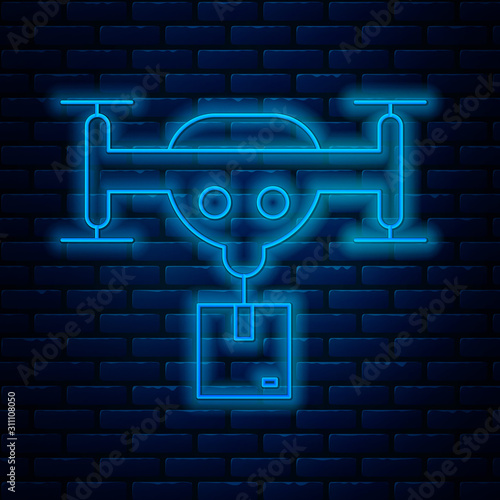 Glowing neon line Delivery drone with the package icon isolated on brick wall background. Drone delivering cardboard box. Vector Illustration