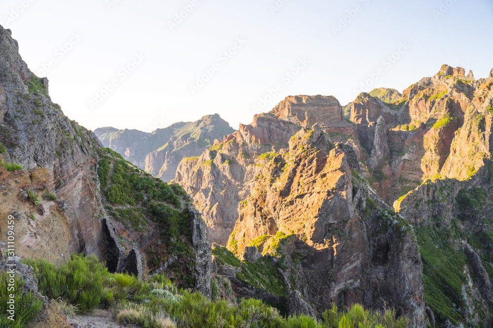Sunset in picturesque mountainous landscape in Portuguese island Madeira on route to highest peaks between Pico Ruivo and Achada do Teixeira. 