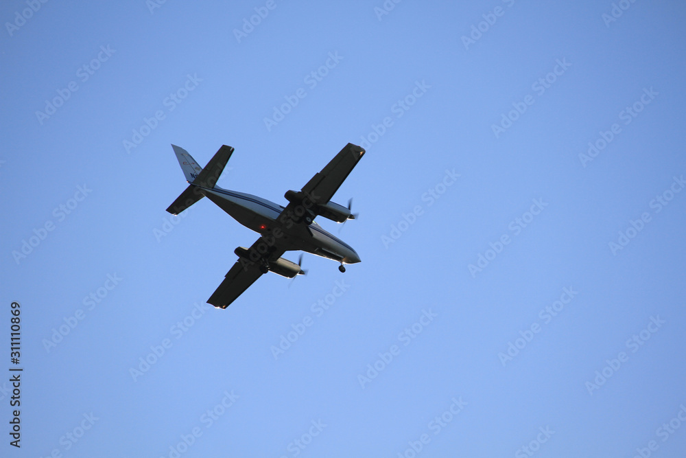 Aircraft flies over Sioux Falls waterfall park Aircraft flies over Sioux Falls waterfall park