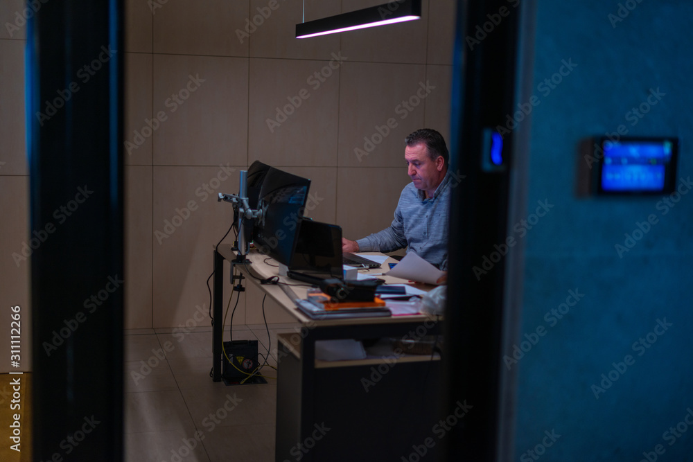 man working on computer in the office man working on computer in the office