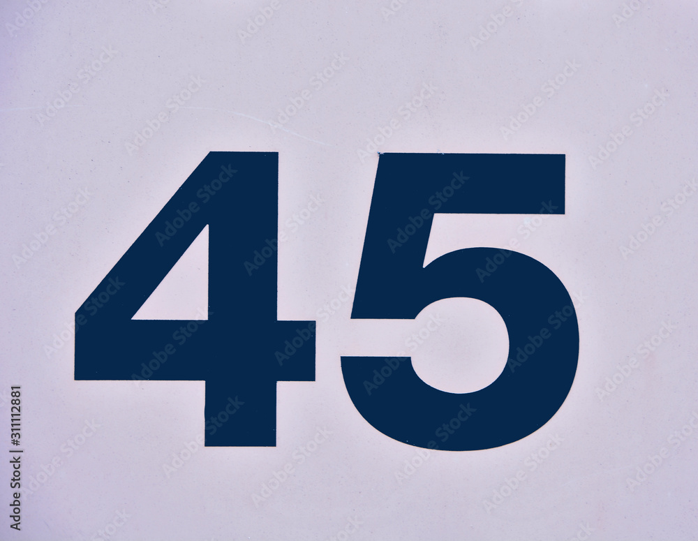Fototapeta premium A house number plaque, showing the number fourty five (45)