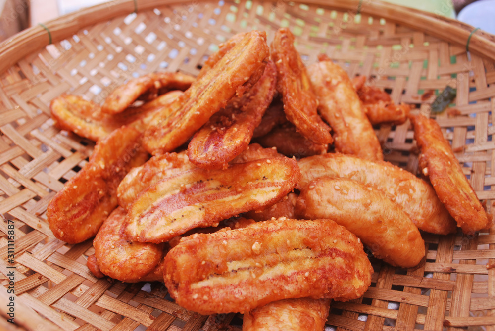 Thai style banana fries sprinkled with nuts and pandan aroma. Thai style banana fries sprinkled with nuts and pandan aroma.