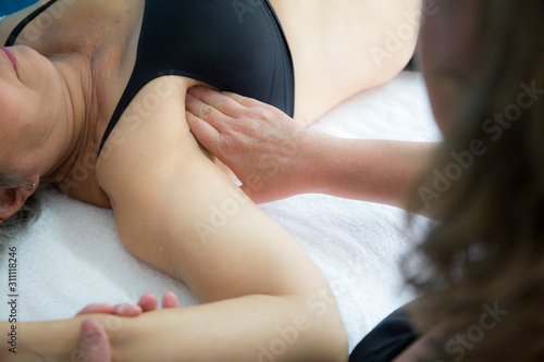Woman having deep tissue massage