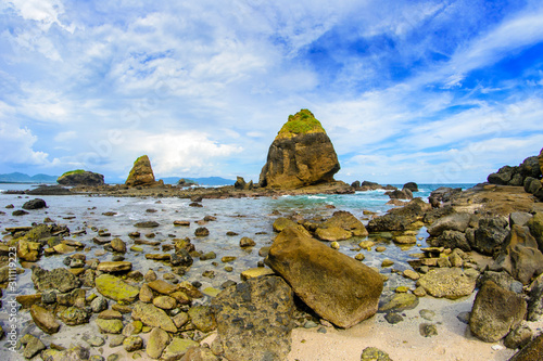 Beautiful rocks on the Papuma Beach, Jember, East Java, Indonesia photo