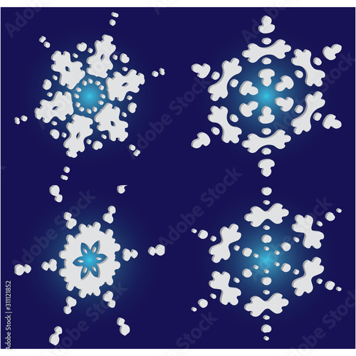Collection of paper cut isolated snowflakes on blue background.